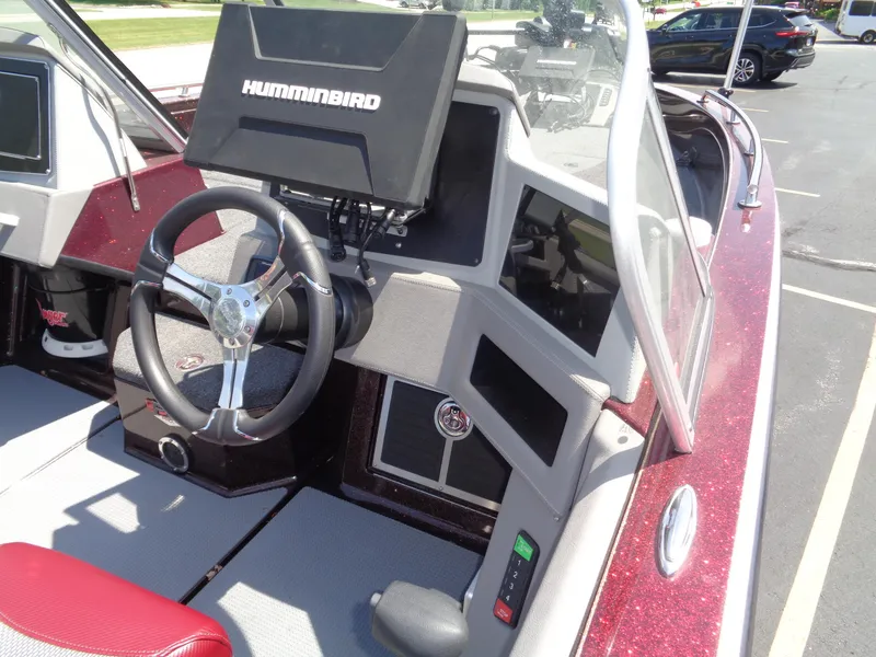 Slide: The Image of 2022 Ranger 621 FS PRO boat dashboard with Humminbird electronics and steering wheel. - 24