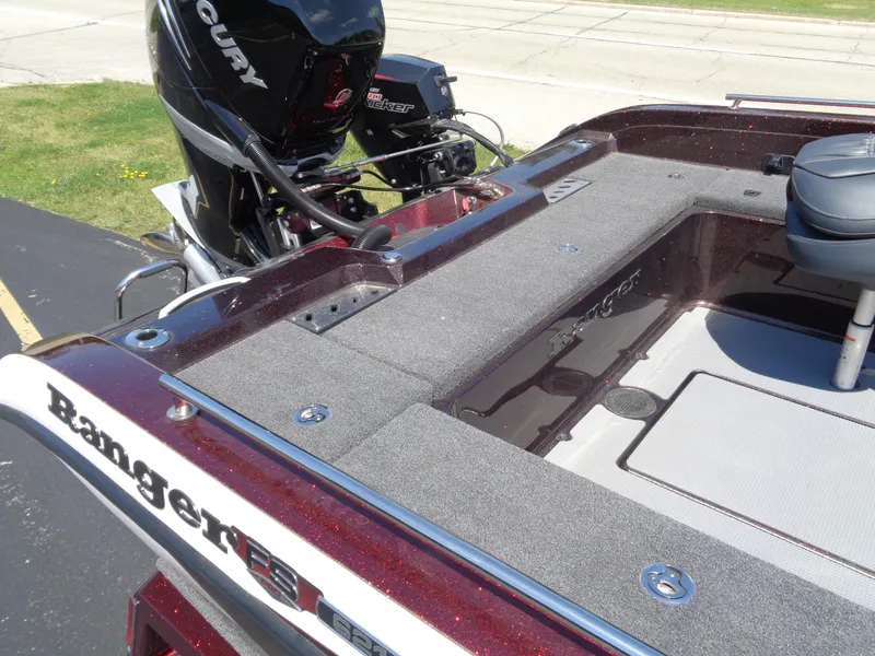 Slide: The Image of 2022 Ranger 621 FS PRO boat with Mercury engine, featuring spacious deck and seating. - 25