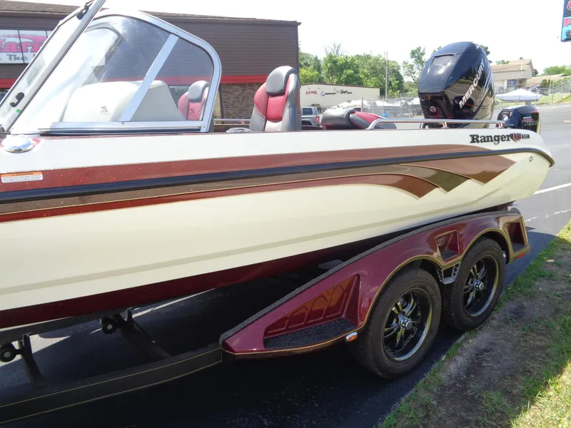 Slide: The Image of 2022 Ranger 621 FS PRO boat with sleek design and dual-axle trailer. - 27