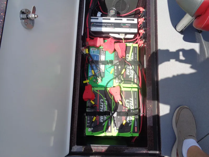 Slide: The Image of 2022 Ranger 621 FS PRO boat battery compartment with lithium batteries and wiring. - 28