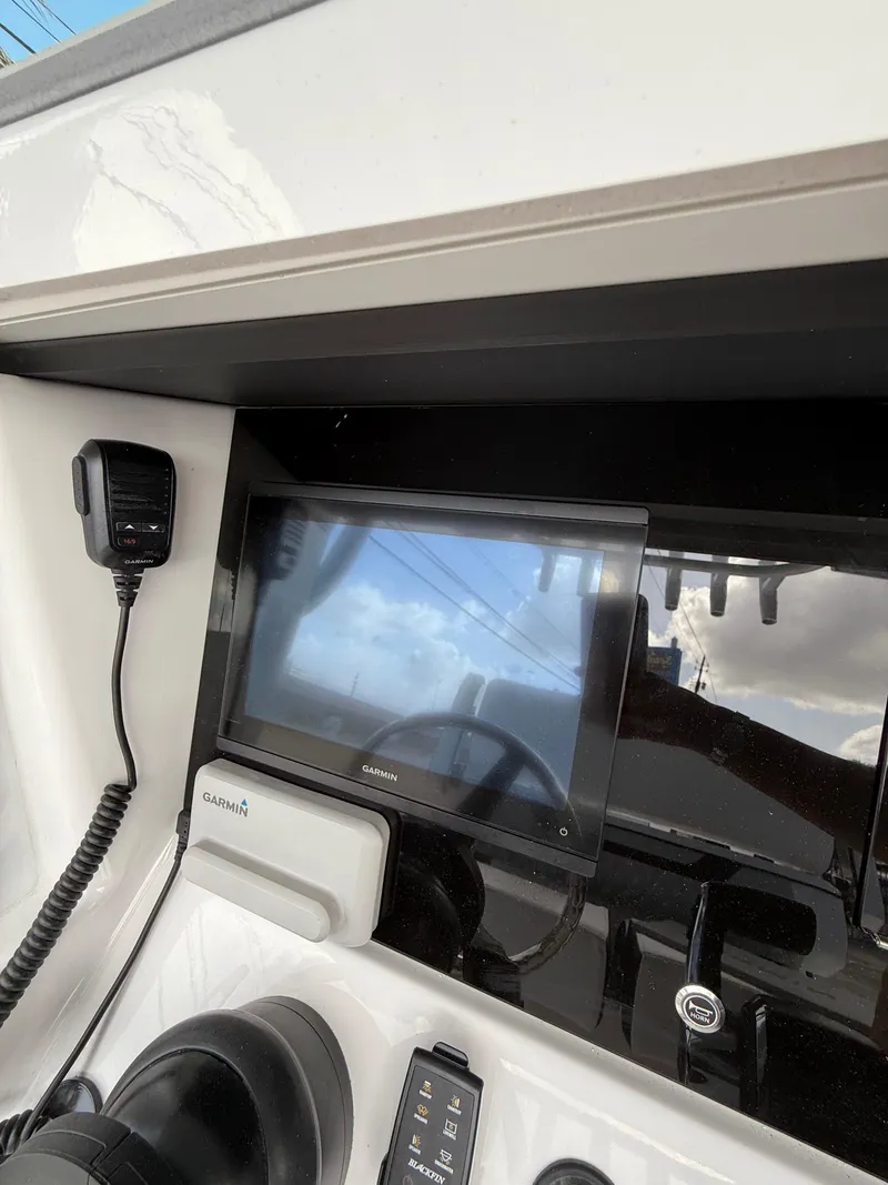 Slide: The Image of Helm of 2026 Blackfin 262 HB with Garmin display and communication equipment. - 12