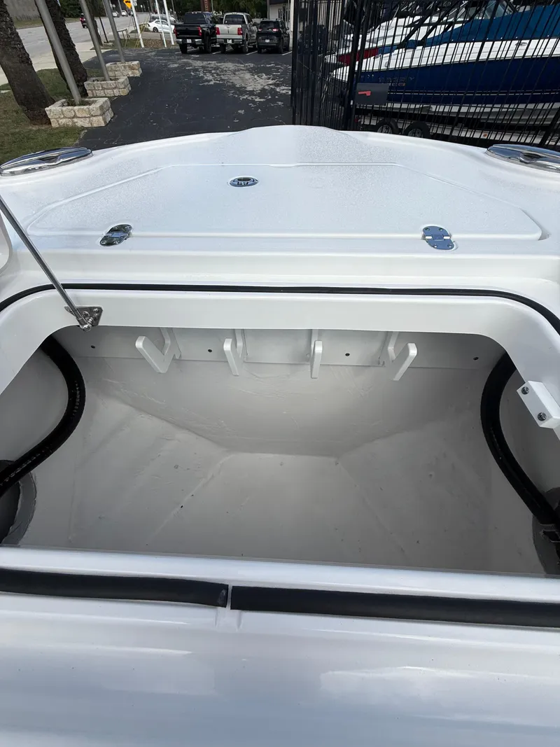 Slide: The Image of Open storage compartment on 2026 Blackfin 262 HB boat, showcasing spacious interior design. - 16