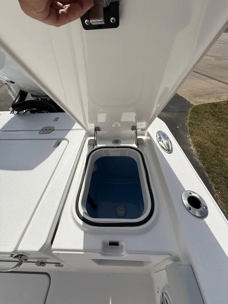 Slide: The Image of Open hatch on 2026 Blackfin 262 HB boat, revealing storage compartment. - 19