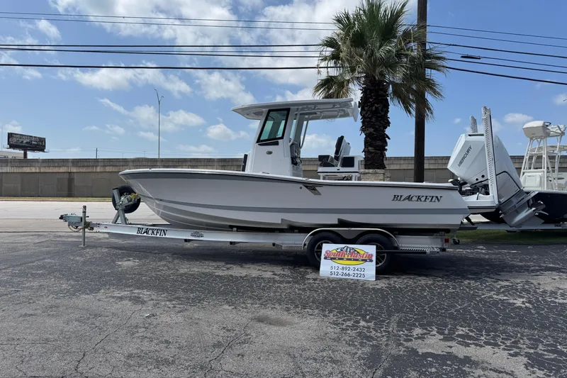 Slide: The Image of 2026 Blackfin 262 HB boat on trailer, parked outdoors under a clear sky. - 20