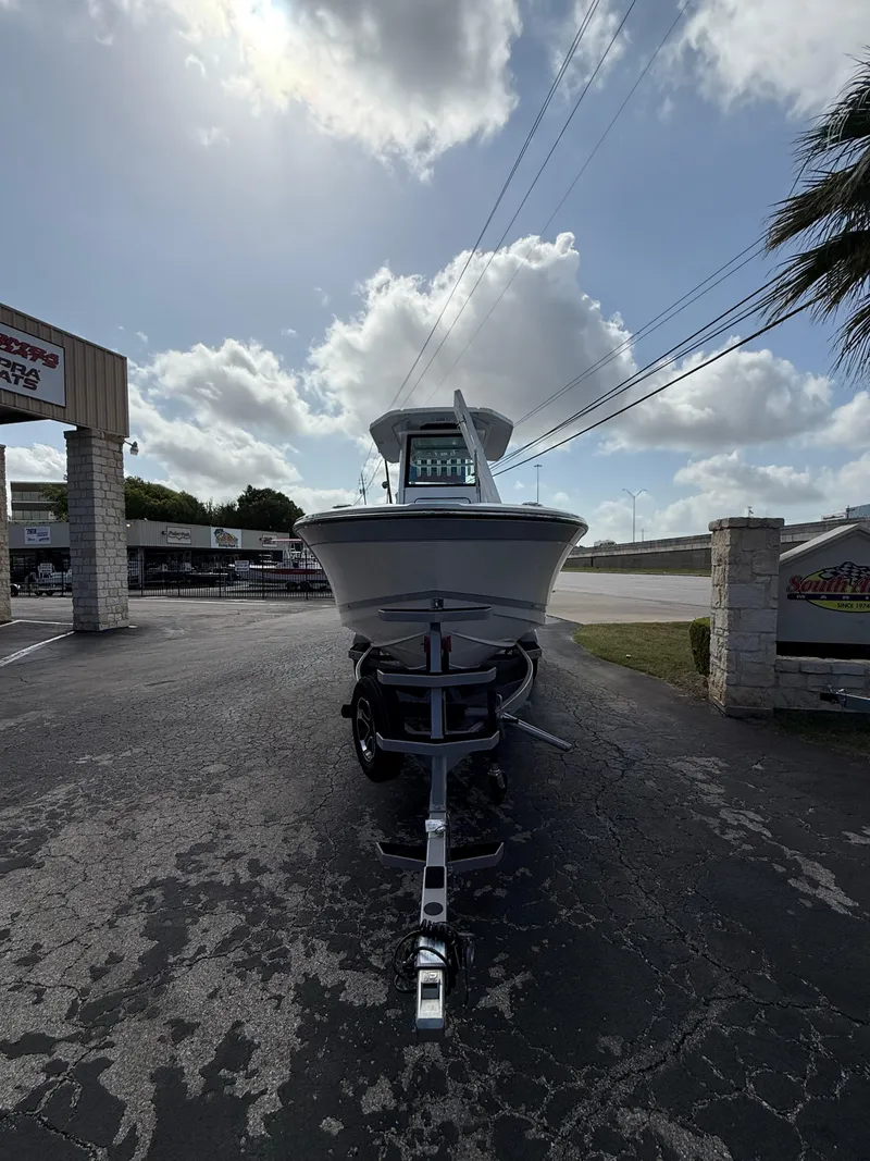 Slide: The Image of 2026 Blackfin 262 HB boat on trailer under cloudy sky in parking lot. - 5