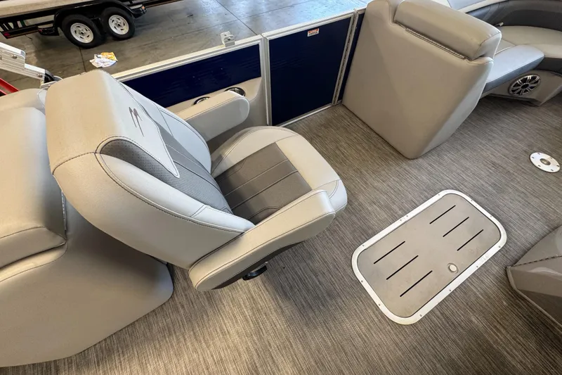 Slide: The Image of 2020 Bennington SX 22 SSRX boat interior with gray seating and flooring. - 15