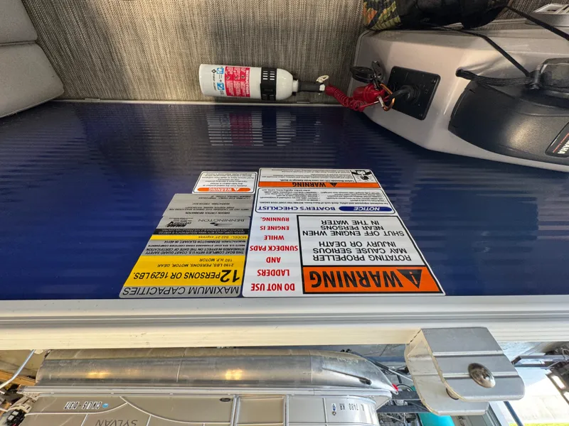 Slide: The Image of Safety warning labels on a 2020 Bennington SX 22 SSRX boat deck. - 6