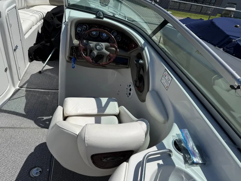 Slide: The Image of 2007 Crownline 270 BR boat cockpit with steering wheel and seating. - 10