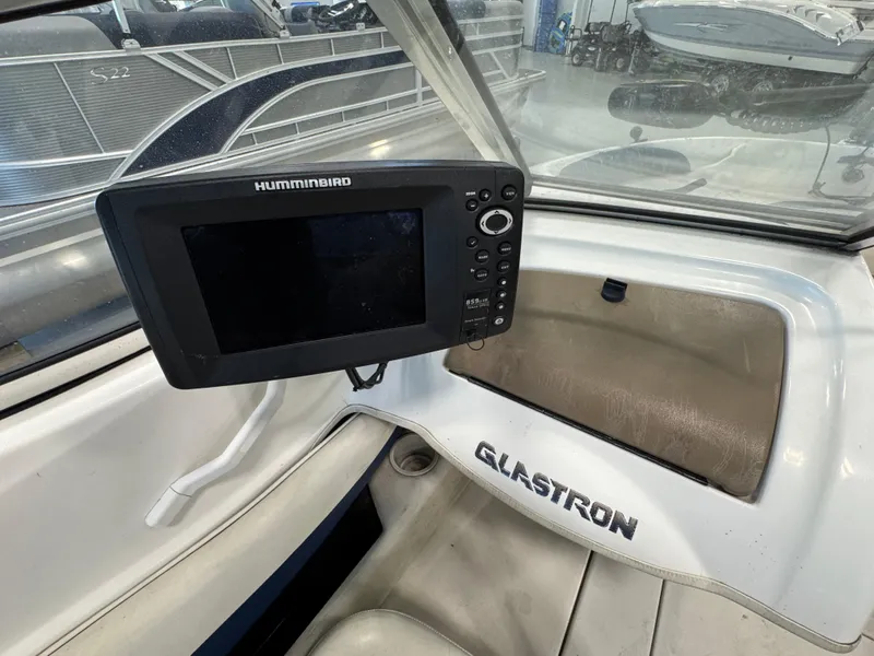 Slide: The Image of 2001 Glastron SX175 boat interior with Humminbird fish finder display. - 10