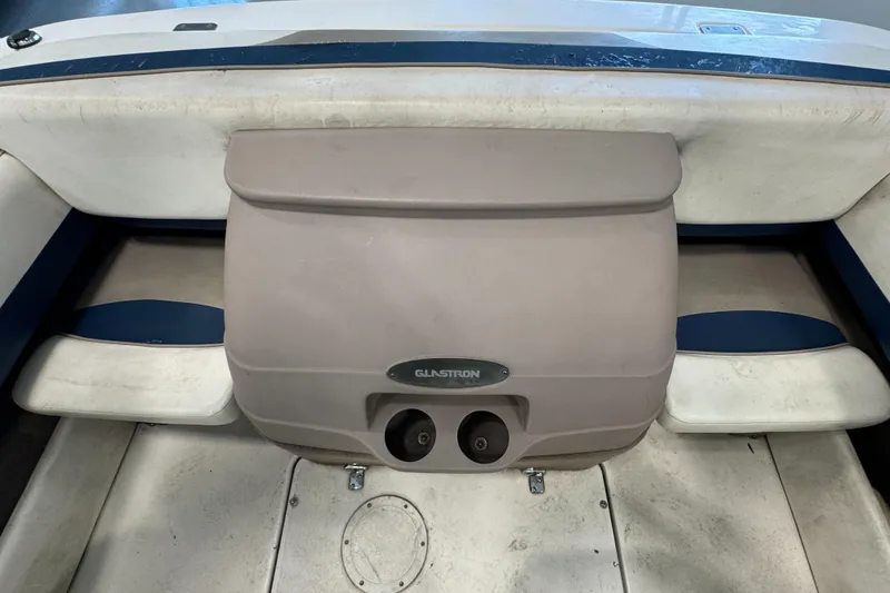Slide: The Image of 2001 Glastron SX175 boat interior with seating and storage compartment. - 15