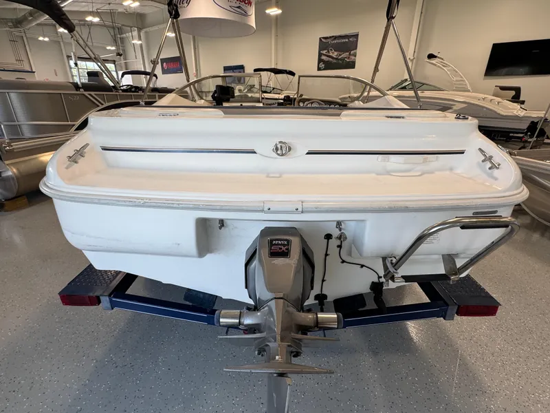 Slide: The Image of 2001 Glastron SX175 boat on trailer in showroom, rear view. - 4
