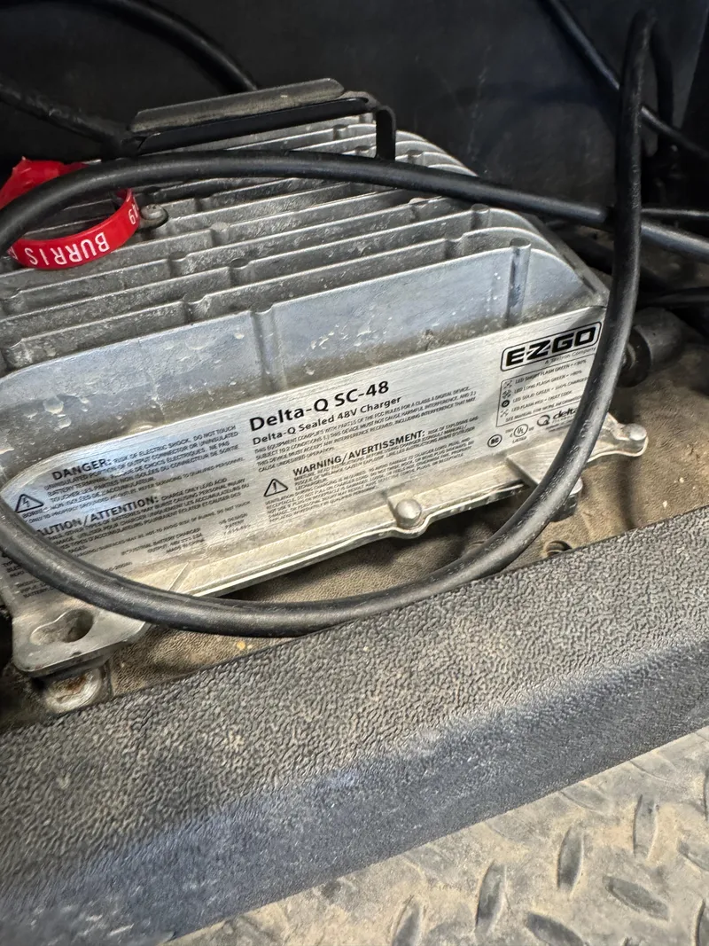 Slide: The Image of Delta-Q SC-48 charger in a 2001 Glastron SX175 boat, with visible cables. - 5