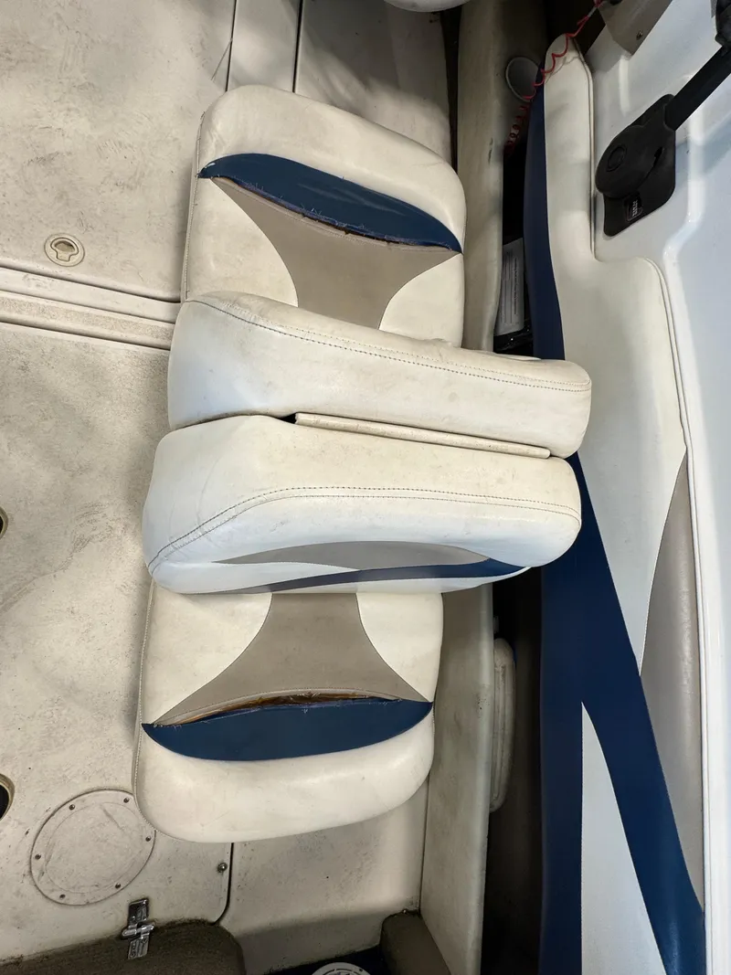 Slide: The Image of 2001 Glastron SX175 boat interior with white and blue seating. - 7