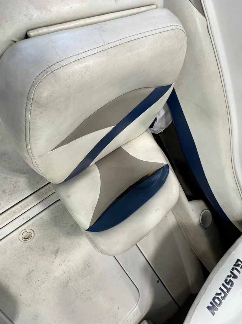 Slide: The Image of 2001 Glastron SX175 boat seat with white and blue upholstery. - 8