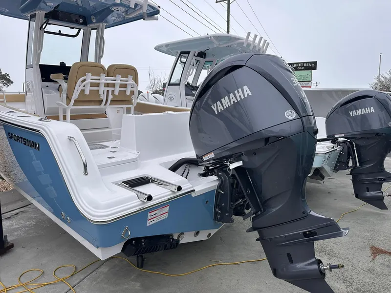 Slide: The Image of 2025 Sportsman Heritage 231 Center Console boat with Yamaha outboard motors. - 10