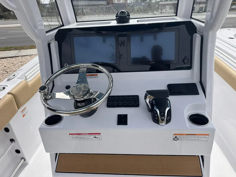 Slide: The Image of 2025 Sportsman Heritage 231 Center Console dashboard with steering wheel and dual screens. - 18