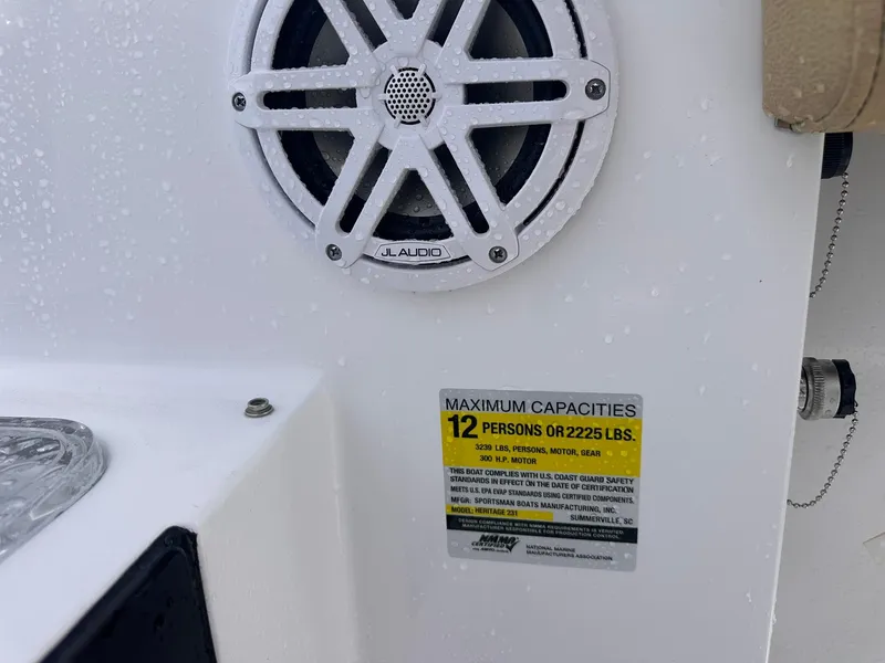 Slide: The Image of Speaker and capacity label on 2025 Sportsman Heritage 231 Center Console boat. - 26