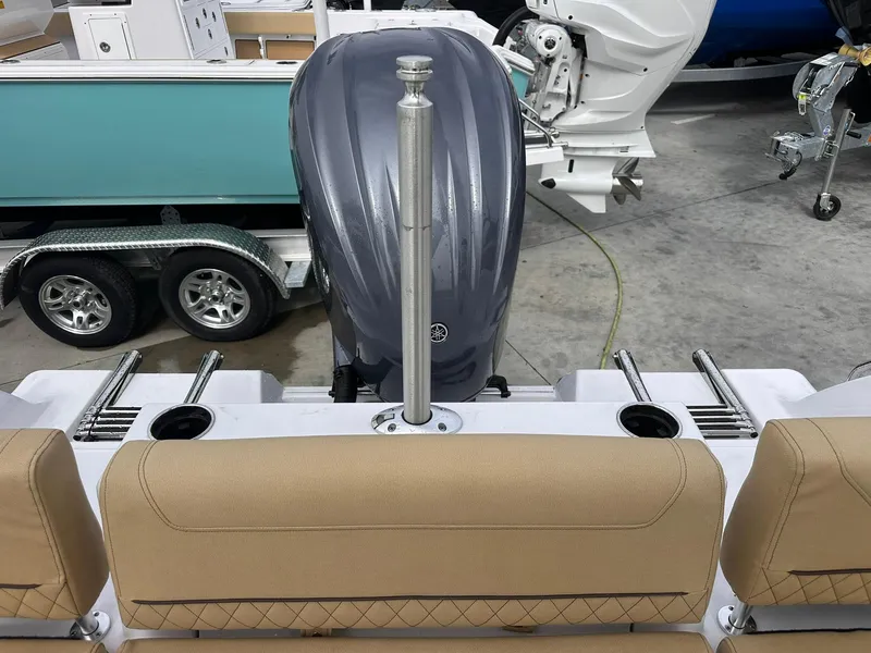 Slide: The Image of 2025 Sportsman Heritage 231 Center Console boat with outboard motor and trailer. - 32