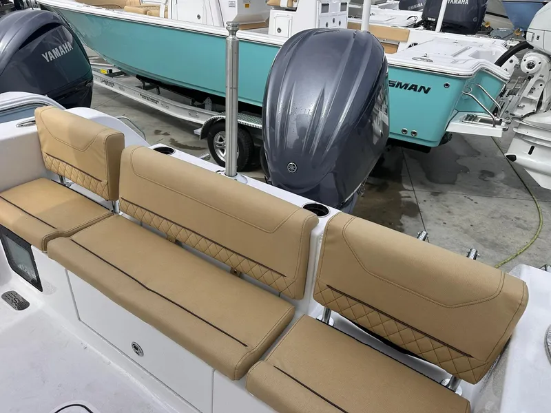 Slide: The Image of 2025 Sportsman Heritage 231 Center Console with tan seating and Yamaha outboard engine. - 33
