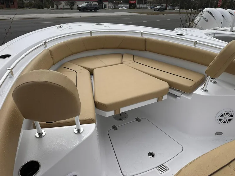 Slide: The Image of 2025 Sportsman Heritage 231 Center Console boat with tan cushioned seating. - 36
