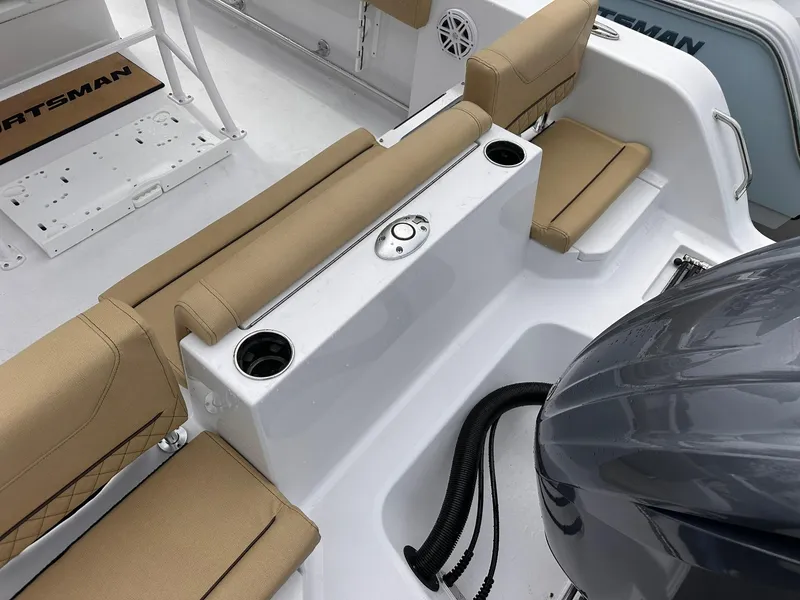 Slide: The Image of 2025 Sportsman Heritage 231 Center Console boat interior with tan seating and cup holders. - 39