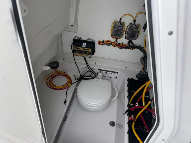 Slide: The Image of 2025 Sportsman Heritage 231 Center Console interior wiring and equipment setup. - 42