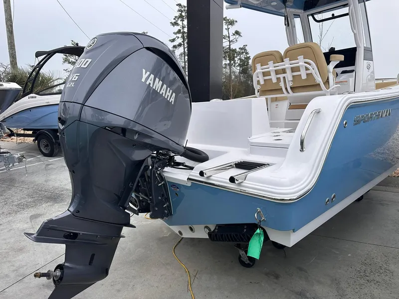 Slide: The Image of 2025 Sportsman Heritage 231 Center Console with Yamaha outboard motor, docked outdoors. - 8