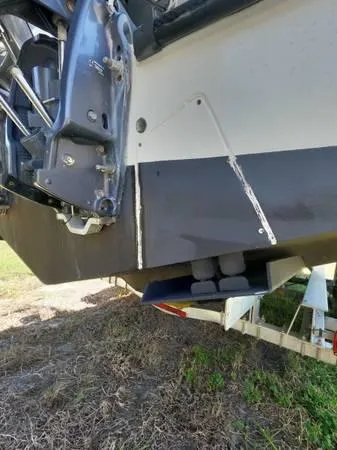 Slide: The Image of 1999 Contender 28 Sport boat on trailer, showing hull and engine mount details. - 6