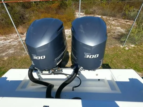 Slide: The Image of Twin Yamaha 300 outboard engines on a 1999 Contender 28 Sport boat. - 9