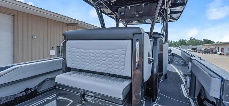 Slide: The Image of 2023 Nor-Tech 390 Sport Center Console boat interior with modern seating and sleek design. - 10