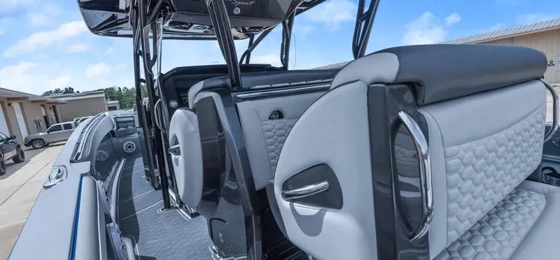 Slide: The Image of 2023 Nor-Tech 390 Sport Center Console interior with modern seating and sleek design. - 11