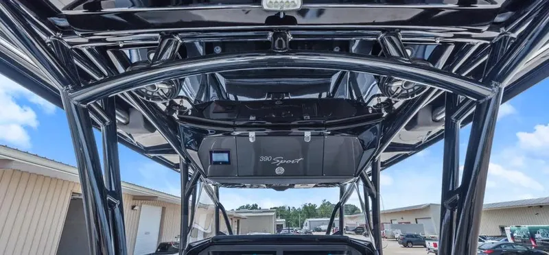 Slide: The Image of 2023 Nor-Tech 390 Sport Center Console boat, showcasing sleek design and sturdy framework. - 13