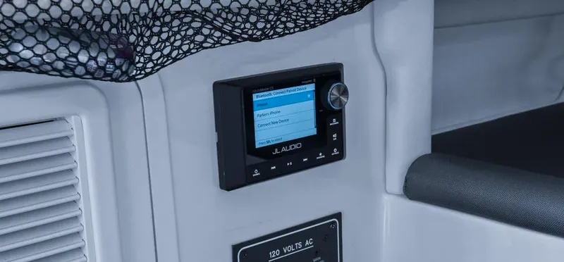 Slide: The Image of Control panel of 2023 Nor-Tech 390 Sport Center Console with JL Audio system. - 16