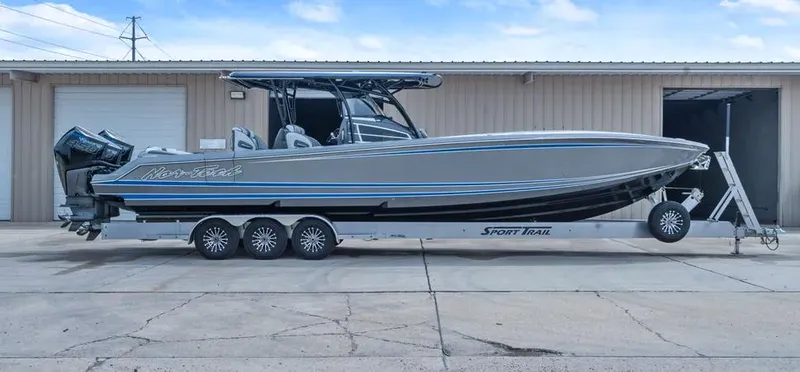 Slide: The Image of 2023 Nor-Tech 390 Sport Center Console boat on trailer, side view. - 3