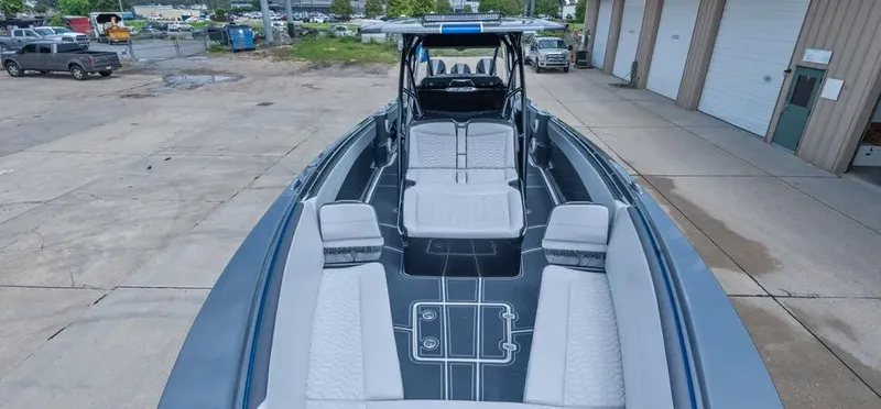 Slide: The Image of 2023 Nor-Tech 390 Sport Center Console boat with spacious seating and sleek design. - 4