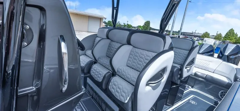 Slide: The Image of 2023 Nor-Tech 390 Sport Center Console interior with luxurious seating and modern design. - 7