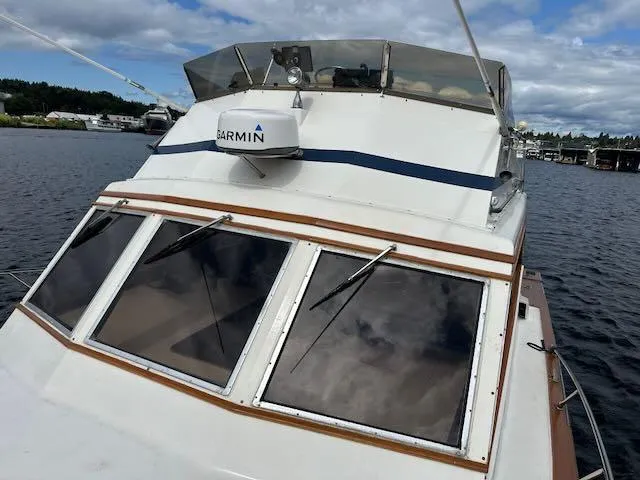 Slide: The Image of 1978 Egg Harbor 36 Sedan boat with Garmin radar on a calm waterway. - 13