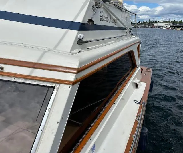 Slide: The Image of 1978 Egg Harbor 36 Sedan boat on water, featuring classic design and wood accents. - 16