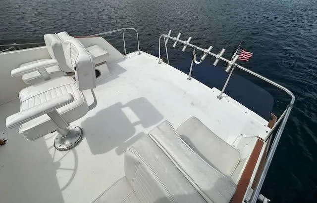 Slide: The Image of 1978 Egg Harbor 36 Sedan boat deck with chairs and fishing rod holders. - 39