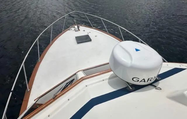 Slide: The Image of 1978 Egg Harbor 36 Sedan boat deck with Garmin radar, on calm water. - 40