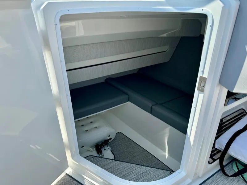 Slide: The Image of Interior cabin of 2022 Cobalt A29 boat with cushioned seating. - 14