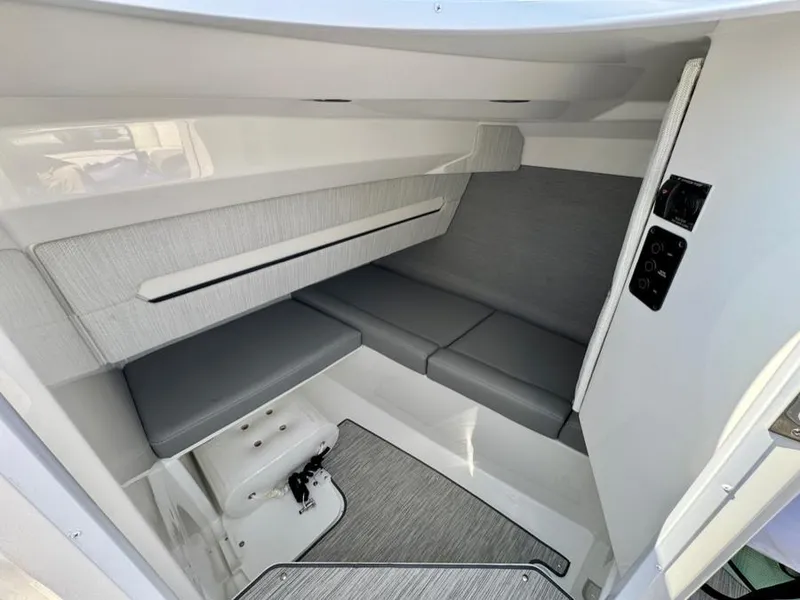Slide: The Image of 2022 Cobalt A29 boat interior with gray seating and modern design. - 15