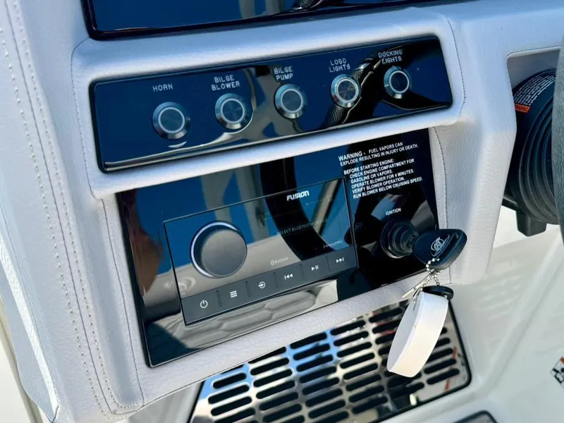 Slide: The Image of Control panel of a 2022 Cobalt A29 boat with ignition and audio system. - 19