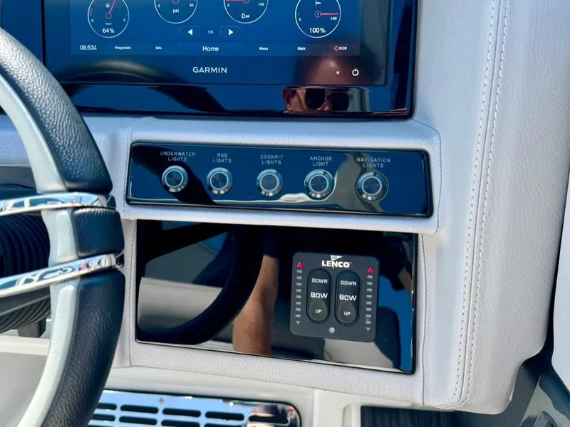 Slide: The Image of Control panel of a 2022 Cobalt A29 boat with Garmin display and Lenco controls. - 21