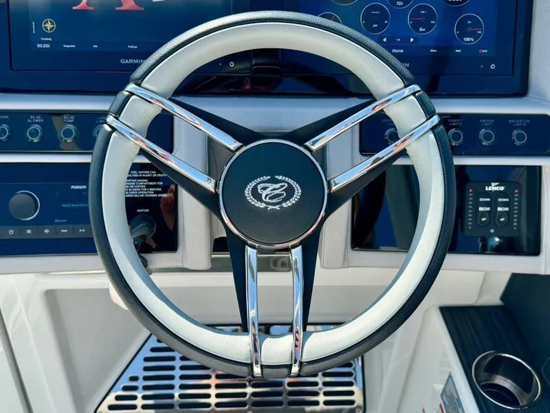 Slide: The Image of Steering wheel of 2022 Cobalt A29 boat with modern dashboard controls. - 22