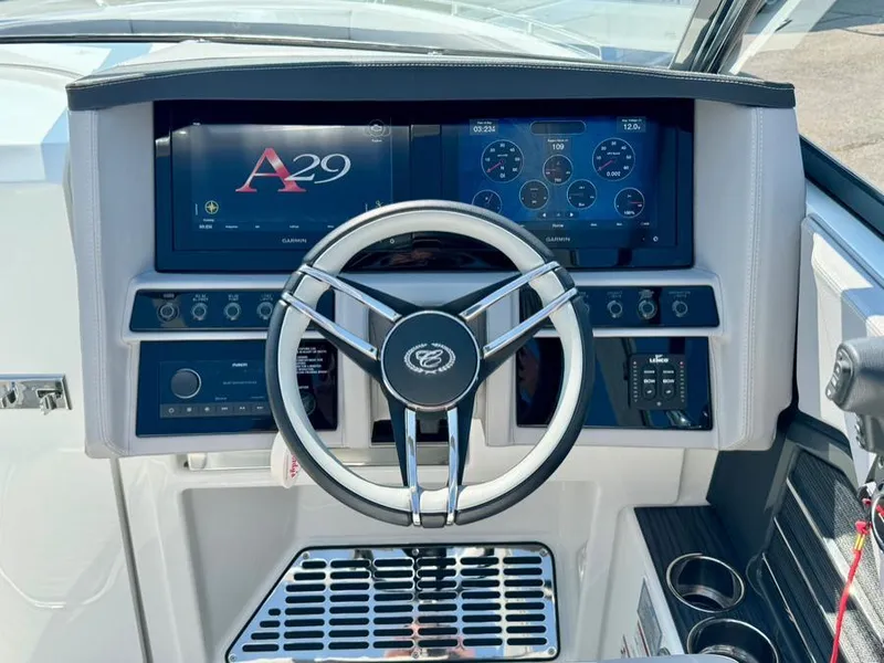 Slide: The Image of 2022 Cobalt A29 boat dashboard with steering wheel and digital displays. - 23