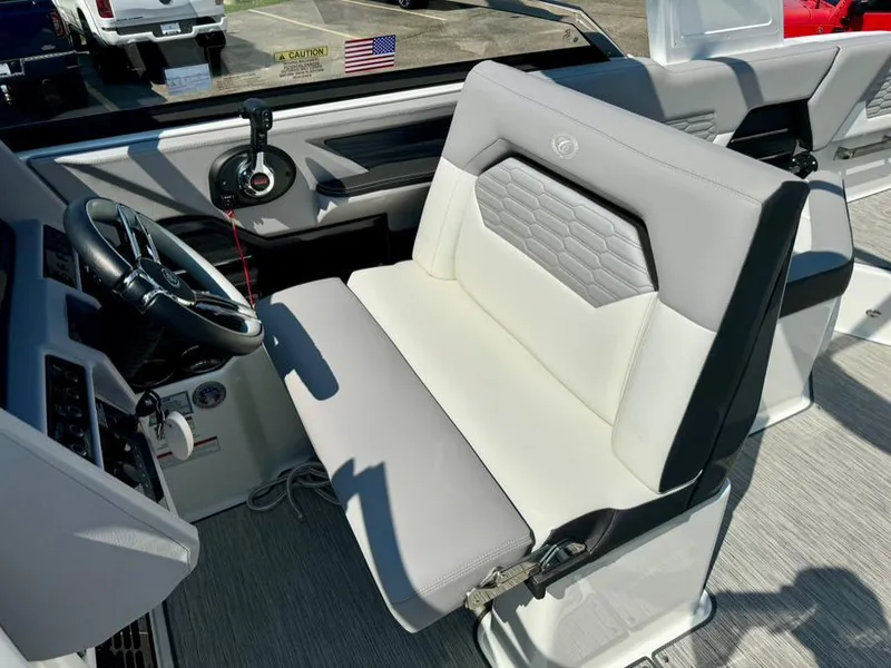 Slide: The Image of 2022 Cobalt A29 boat interior with modern steering and comfortable seating. - 25