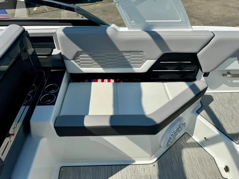 Slide: The Image of 2022 Cobalt A29 boat interior with modern seating and cup holders. - 35
