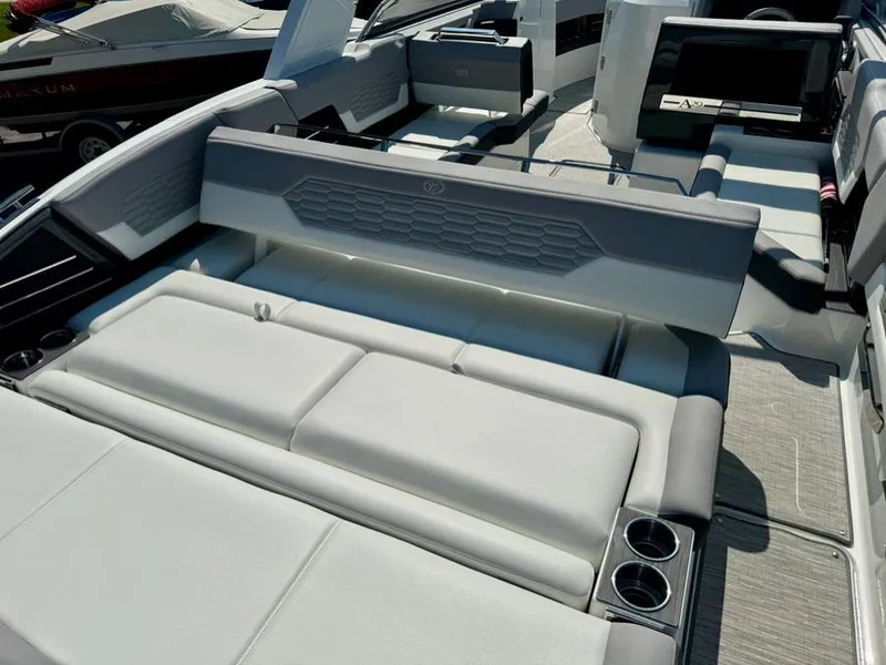 Slide: The Image of 2022 Cobalt A29 boat interior with luxurious seating and cup holders. - 39