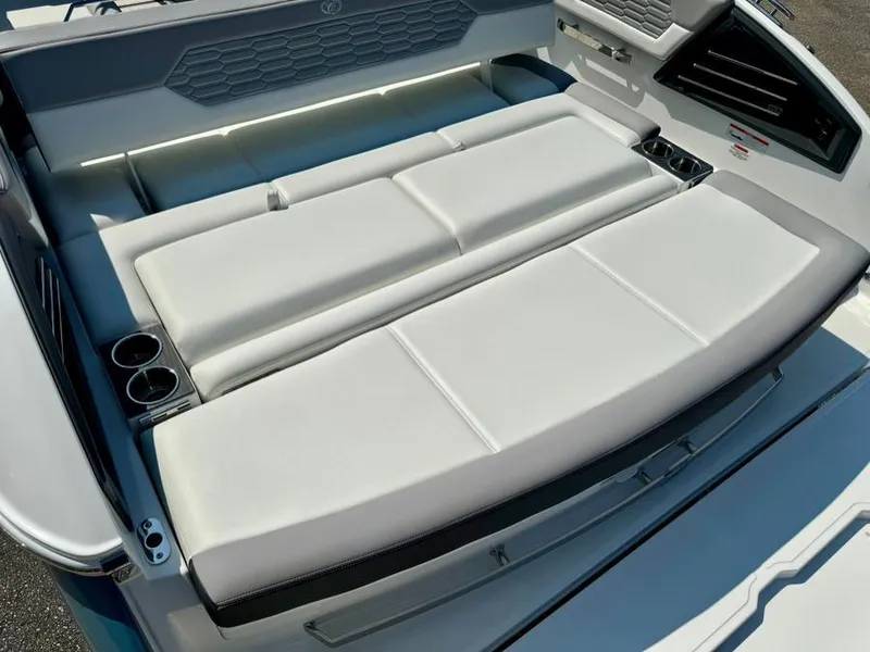Slide: The Image of 2022 Cobalt A29 boat with spacious white cushioned seating and cup holders. - 40
